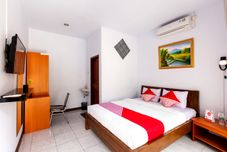 卧室 OYO 569 Cigadung Guest House Syariah