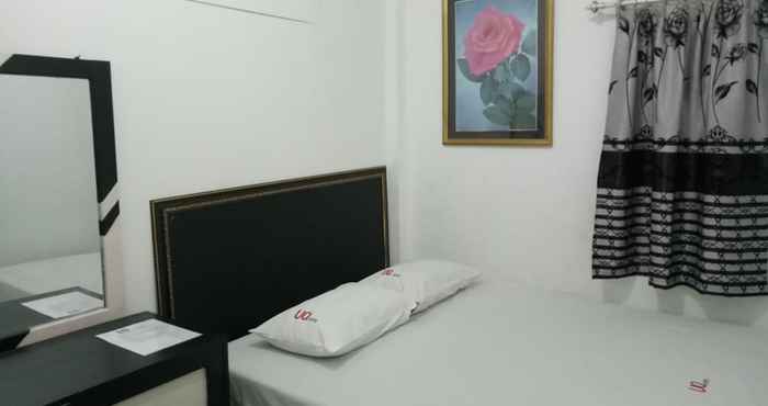 ห้องนอน UQ Hotel Syariah