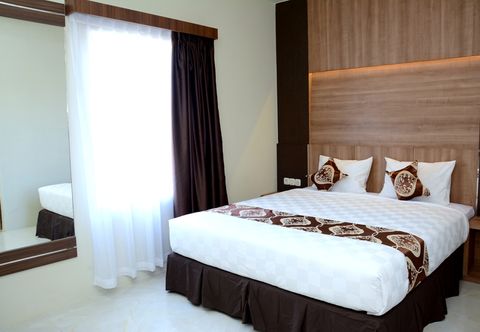 Bedroom D'Holiday Hotel Makassar