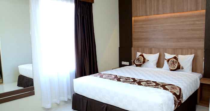 Bedroom D'Holiday Hotel Makassar