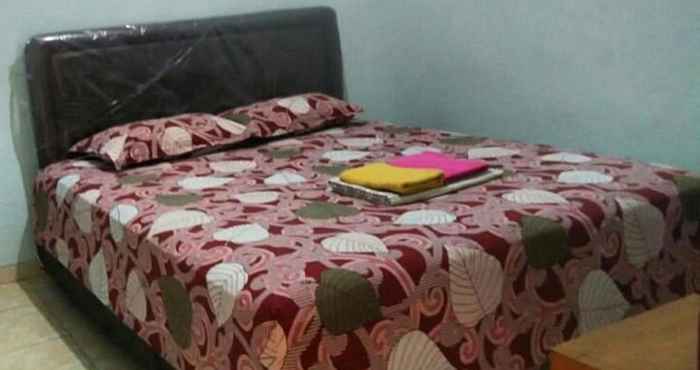 Kamar Tidur Penginapan Pelangi