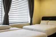 Kamar Tidur Goldbrick Hotel