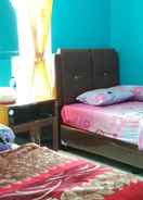 BEDROOM Cozy Room at Kharisma Homestay (SG)