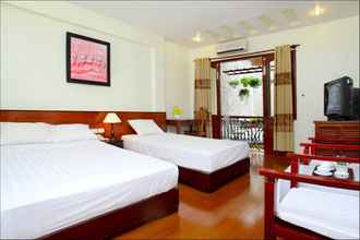 Kamar Tidur 4 Nhi Trung Hotel