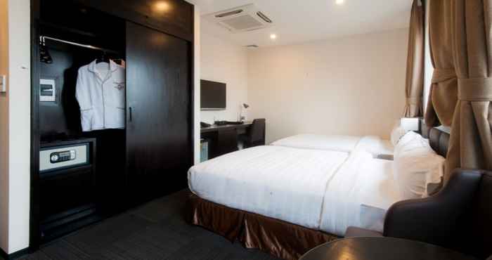 Kamar Tidur Sakura Hotel 1