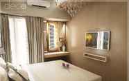 ห้องนอน 4 Studio Room at Cosmy Orchard Apartment