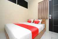 ห้องนอน Super OYO 1250 Unta Residence