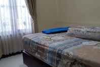 Bedroom Homy Room at Homestay Cemara 7