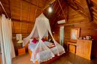 Bedroom Ayu Laba Beach Villa and Resto