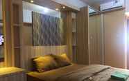 Bedroom 7 Apartemen Green Lake View By Hexa Room