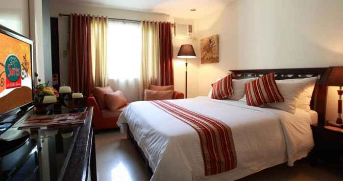 Kamar Tidur The Suites at Calle Nueva