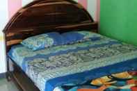 Bedroom Ekas Beach Homestay