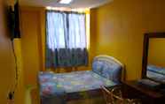 Kamar Tidur 7 OYO 89406 Lucky Budget Hotel