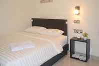 Kamar Tidur Guardian Family Hotel