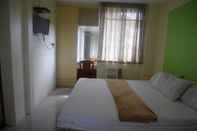 Kamar Tidur Clada Travellers Inn