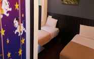 Kamar Tidur 2 Hotel Pop Ash & Guesthouse