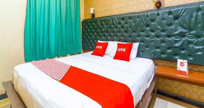 Bedroom OYO 90788 Nillo Hotel