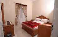 Phòng ngủ 6 Merapi Singgalang Guest House