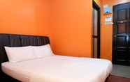 Kamar Tidur 2 Hotel Fifteen Avenue Inn - OYO TM