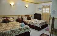 Kamar Tidur 2 D' Lucky Garden Inn and Suites