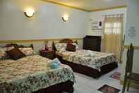 Kamar Tidur D' Lucky Garden Inn and Suites