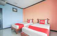 Kamar Tidur 5 OYO 1145 Prickhom Garden Hotel