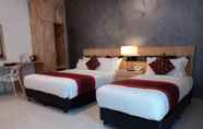 Kamar Tidur 6 Hotel Adya Express Chenang