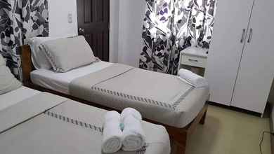 Kamar Tidur 4 Florabell's Iraya Guesthouse