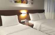 Kamar Tidur 3 The Podium Boutique Hotel