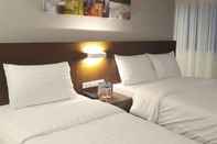 Kamar Tidur The Podium Boutique Hotel