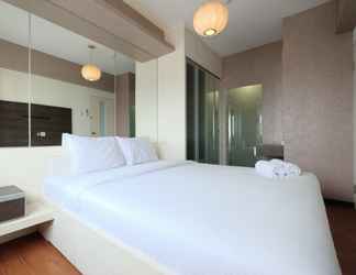 Bedroom 2 Modern 2BR Mutiara Bekasi Apartment by Travelio