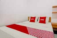 Kamar Tidur Super OYO 90432 Family Residence