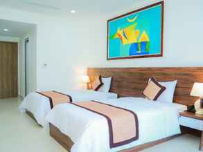 Kamar Tidur 4 The Harmonia Hotel