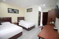 Bedroom Grand Mahoni Hotel