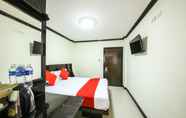 Kamar Tidur 4 OYO 118 Beach Walk Stay