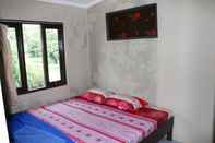 Bedroom Cozy Homestay Anggrek by Damandiri Selo