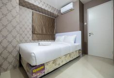 Bedroom 2 Comfy 2BR Bassura City Apartment near Mall by Travelio