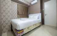 Bedroom 2 Comfy 2BR Bassura City Apartment near Mall by Travelio