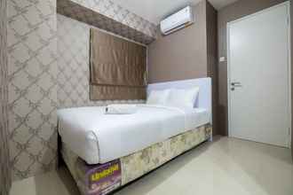 Bedroom 4 Comfy 2BR Bassura City Apartment near Mall by Travelio