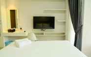 Bedroom 6 Mahogany Suites Studio Room The Oasis Apartment Cikarang by Travelio