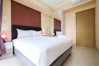 Kamar Tidur Bright and Stylish 1BR The Oasis Apartment Cikarang by Travelio