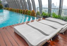 Swimming Pool 5 2BR Cozy and Modern L'Avenue Apartment by Travelio
