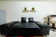 Lobby 2BR + Sofa Bed The Springlake Summarecon Bekasi Apartment by Travelio