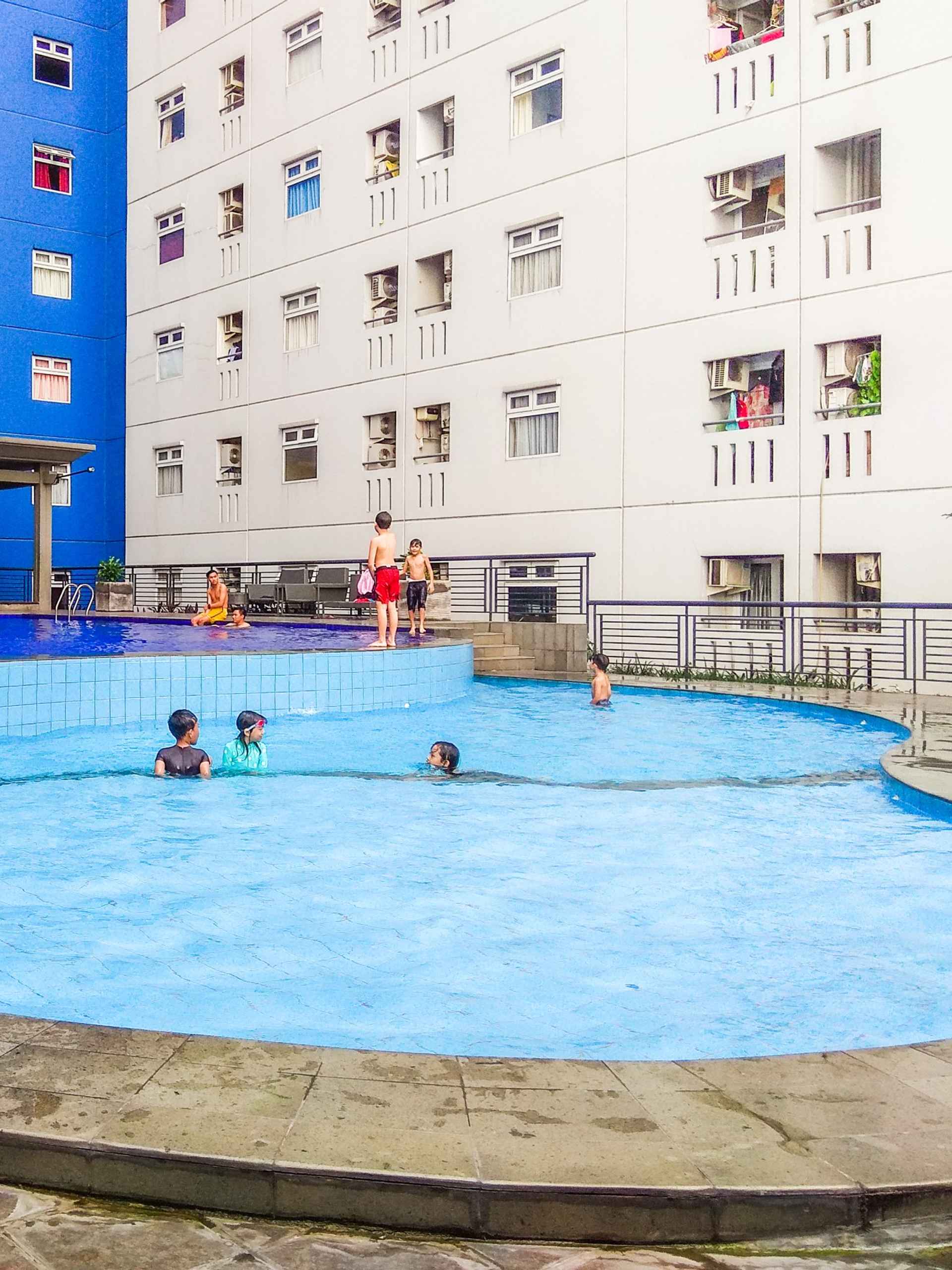 Swimming Pool Studio City View Green Pramuka City Apartment by Travelio