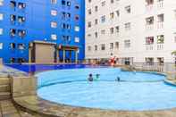 Swimming Pool Studio City View Green Pramuka City Apartment by Travelio