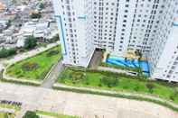 Exterior Connect to Pool 2BR Apartment at Bassura City by Travelio