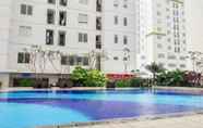 Swimming Pool 2 Connect to Pool 2BR Apartment at Bassura City by Travelio