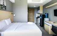 Bedroom 5 Brand New Studio The Oasis Apartment by Travelio