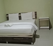 Bedroom 3 Rumoh Aceh Hotel