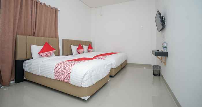 ห้องนอน OYO 443 Hotel Barlian